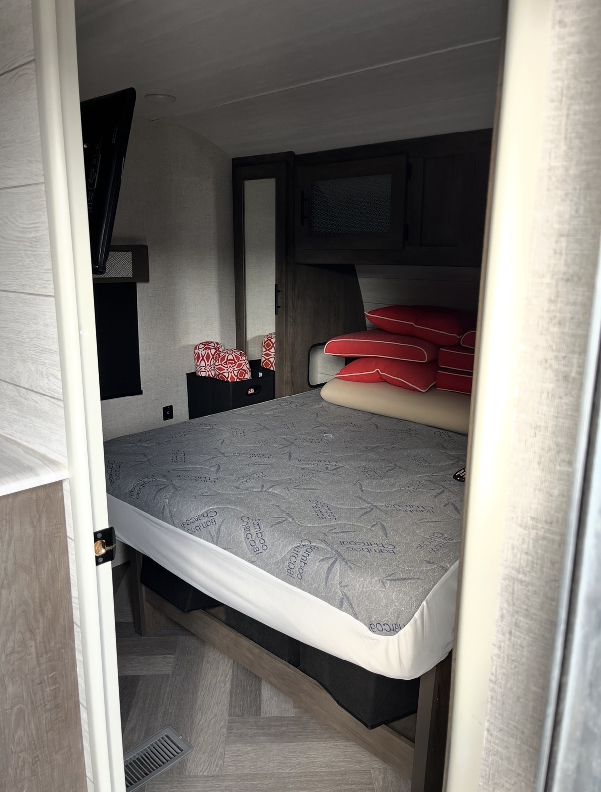 View of private front queen bedroom.